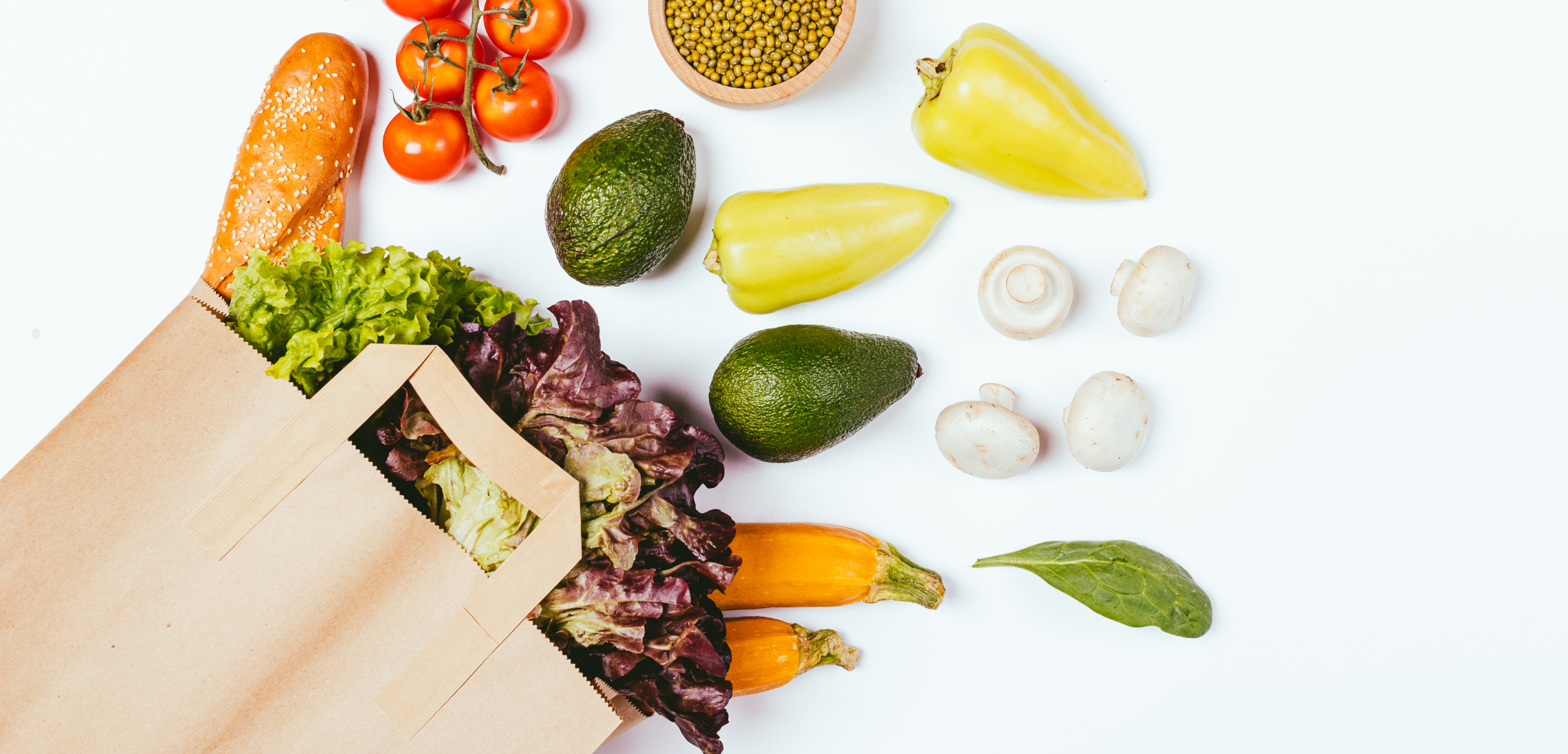 Grocery bag with Whole Foods fruits and vegetables to make healthy meal prep