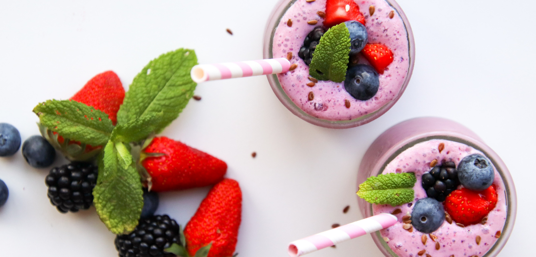 Superfood protein smoothie with meal replacement powder, strawberries, and blueberries