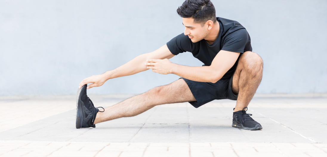 Man stretching for post workout recovery