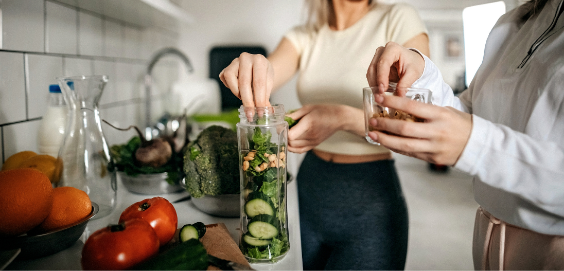 Cooking whole foods meals in kitchen