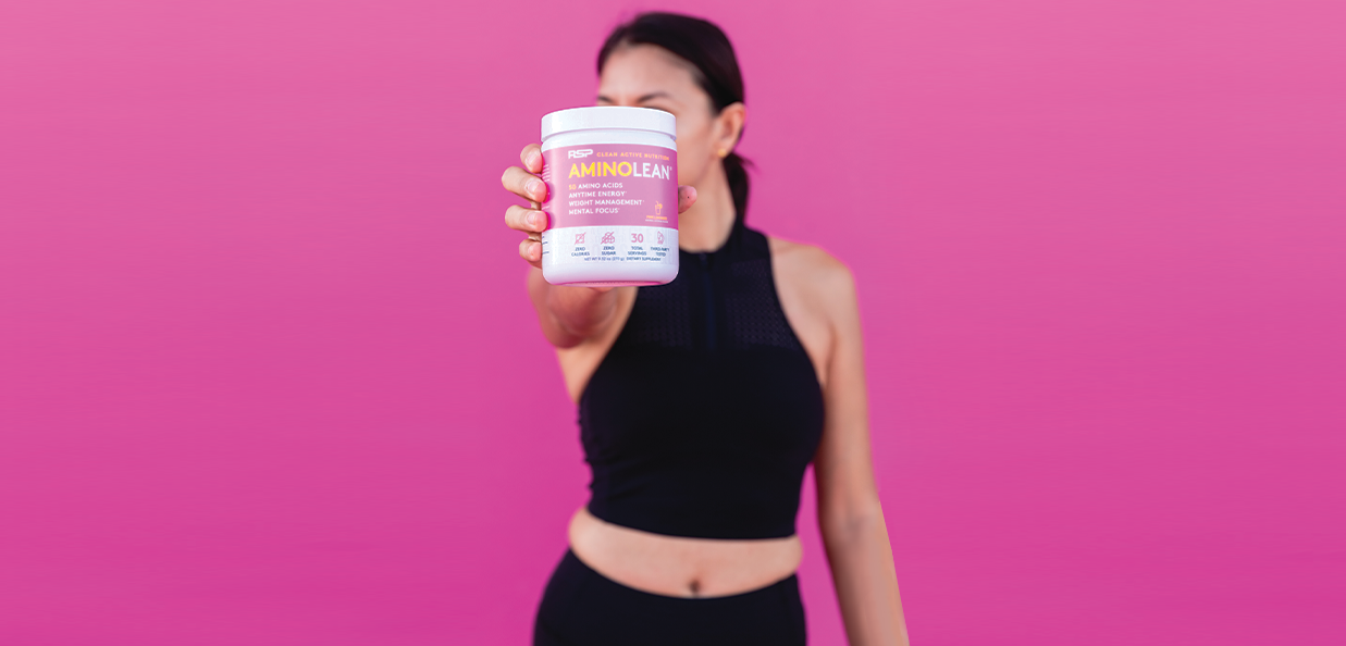 Woman drinking amino lean pre workout for women pink lemonade