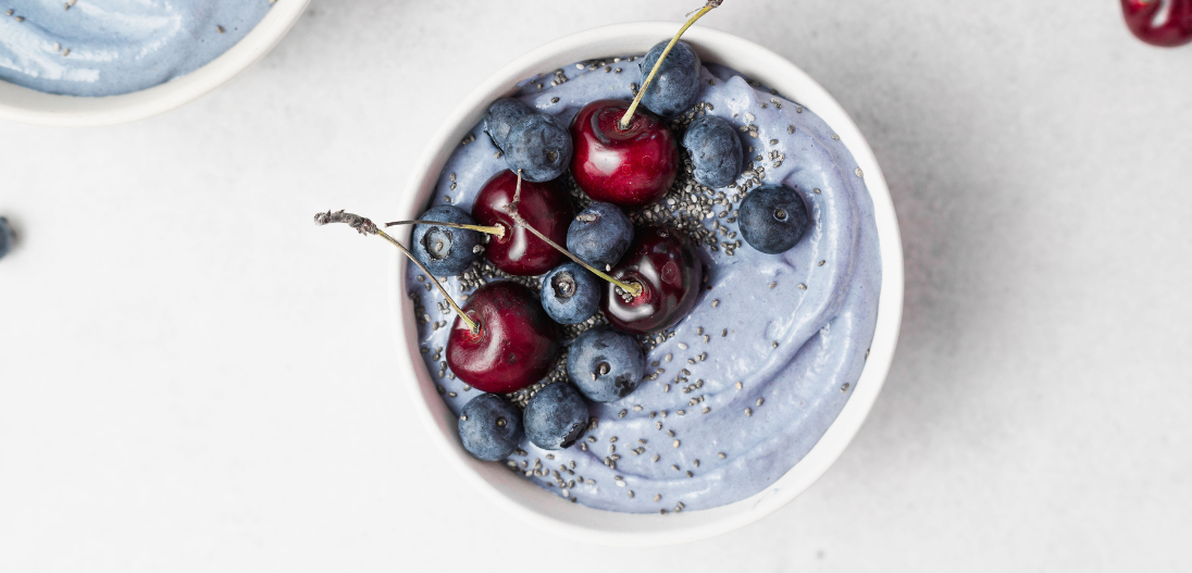 Superfood protein ice cream with cherries and blueberries