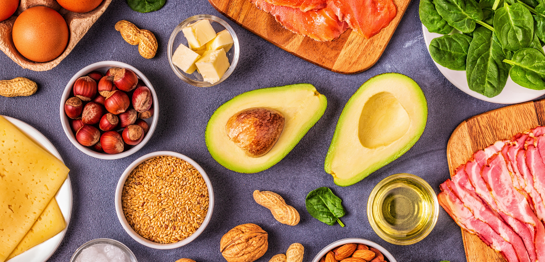 Various keto foods such as red meat, avocado, nuts, and spinach