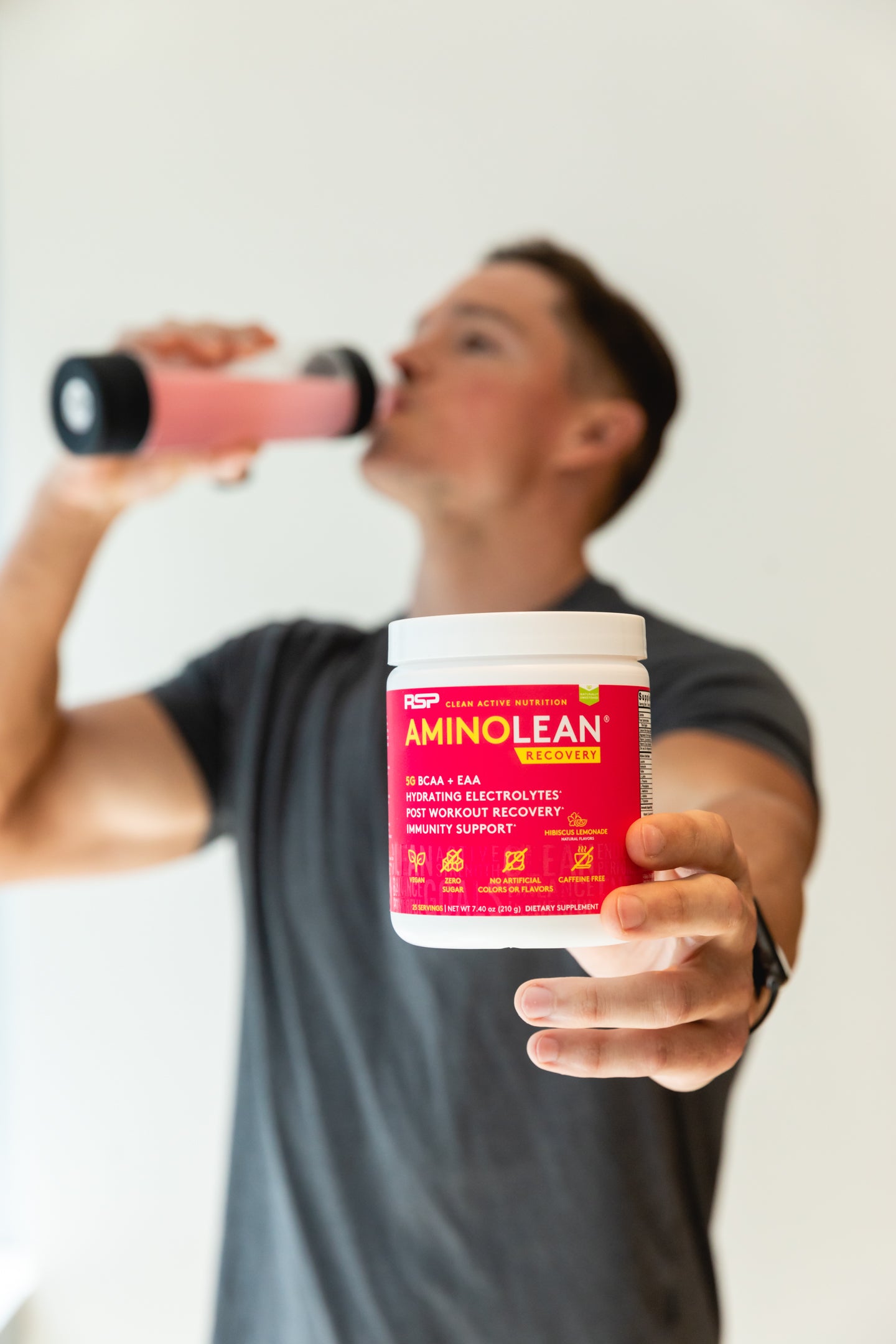man drinking amino lean recovery hibiscus lemonade